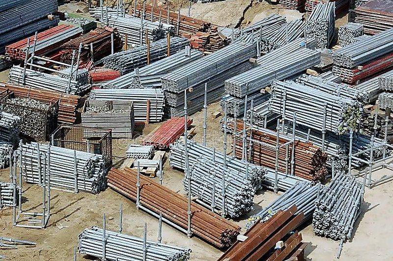 Construction site with scaffolding and steel materials