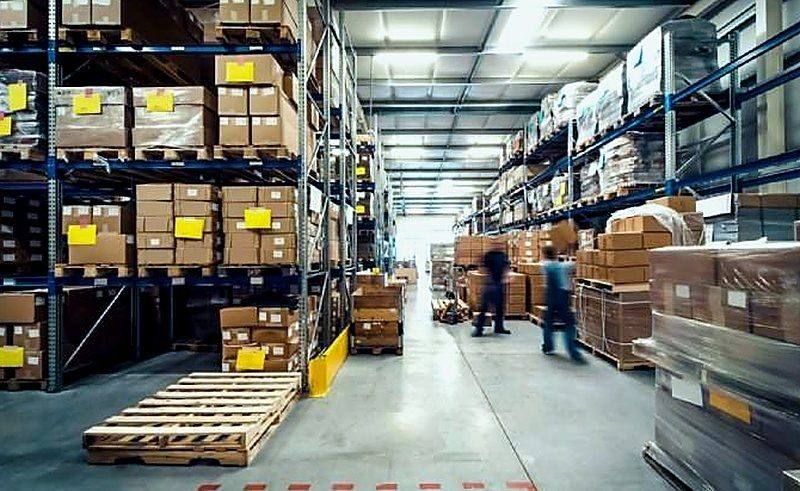 Distribution warehouse with workers and shelving